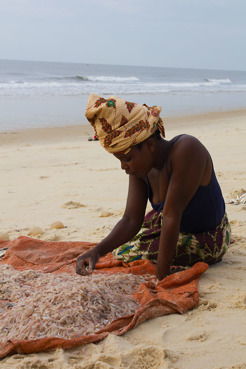 <p>Lady sorting prawns to sell, Njalane, Mozambique</p>