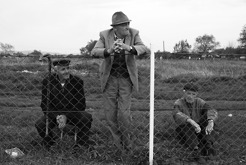 <p>Footbal game spectators over and through the fence</p>