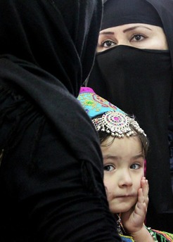 <p>A young Afghan girl attends an election staff training with her mom.</p>
<p>2014 | Kabul | Afghanistan</p>