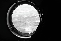 <p>During an helicopter ride to Bamyan, a female afghan UN staff overlooks the mountains of Daykundi.</p>