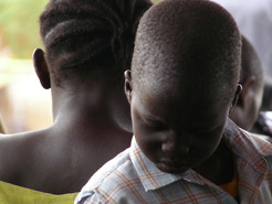 <p>Before the start of an SPLM party rally, a boy prays.</p>
<p>2009 | Juba | Sudan</p>